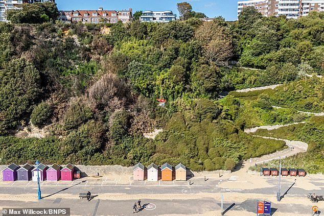 102443779-15133615-The_encampment_pictured_centre_above_four_beach_huts_has_trigger-a-7_175881529075.jpeg