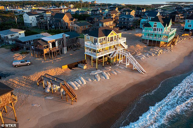 102609969-15164573-The_homes_were_the_latest_beachfront_structures_to_fall_in_the_H-a-67_17596958019.jpeg