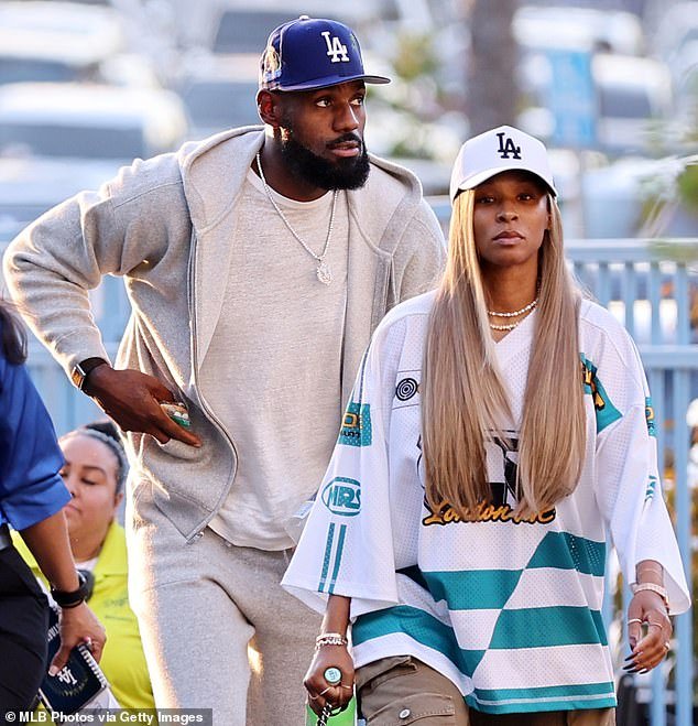 103399553-15236389-LeBron_and_Savannah_James_arrive_at_Dodger_Stadium_for_Game_4_of-a-1_176173631053.jpeg
