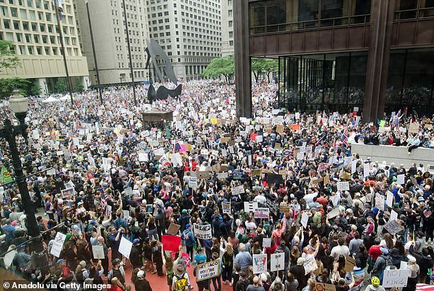 99388375-15198217-Thousands_of_demonstrators_gathered_in_Chicago_s_Daley_Plaza_for-a-125_17607937953.jpeg