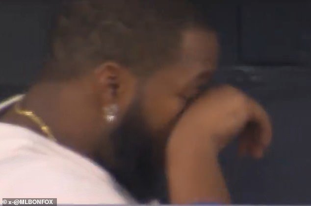 103525637-15250273-Vladimir_Guerrero_Jr_was_seen_wiping_away_tears_following_his_te-a-17_17620929897.jpeg