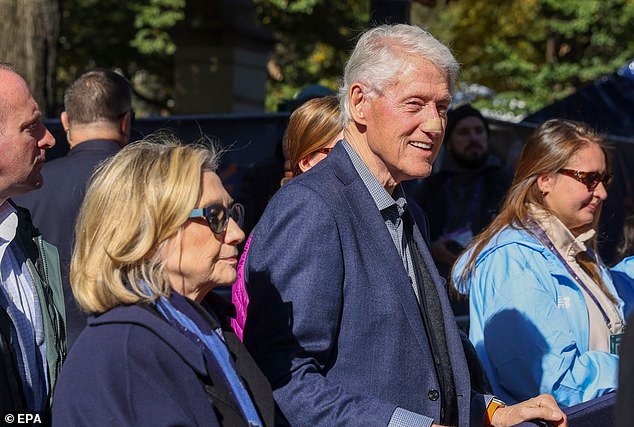 103530423-15251367-Former_US_President_Bill_Clinton_R_and_Hillary_Clinton_L_wait_fo-a-1_176211979525.jpeg