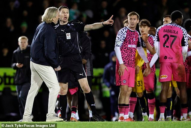 104303281-15338345-The_referee_suggests_to_Robbie_Savage_that_he_leaves_the_field_i-a-2_176445832220.jpeg