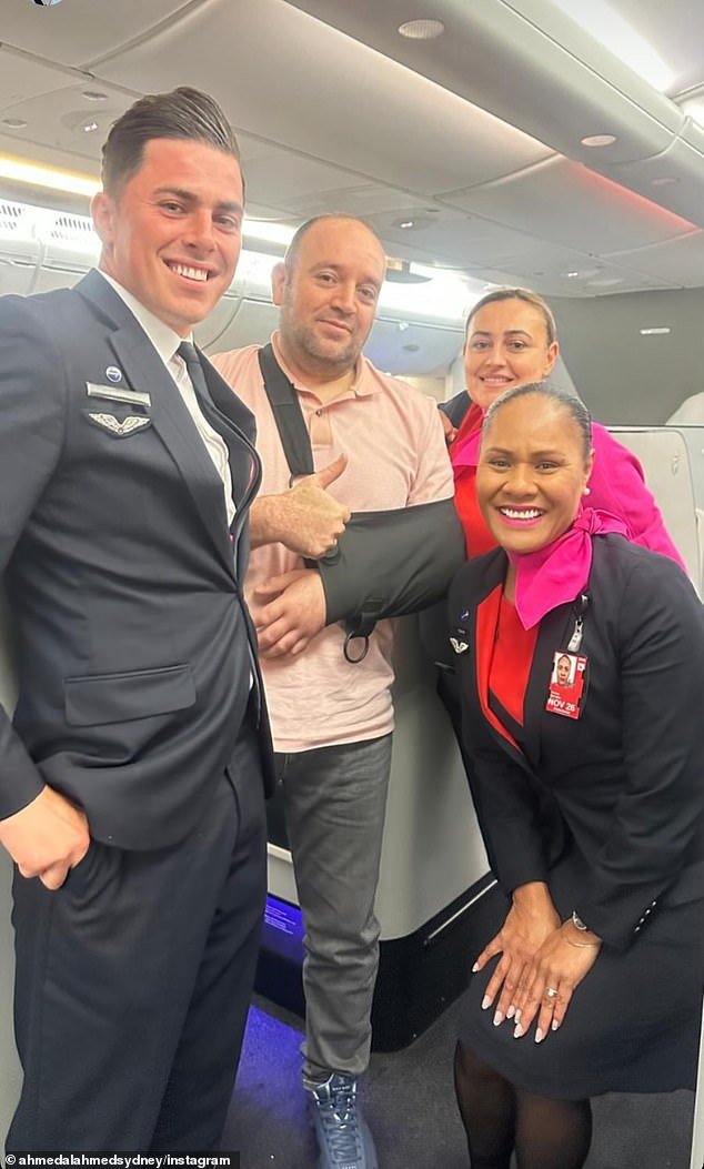 105264195-15437671-Mr_Ahmed_is_pictured_in_business_class_with_flight_attendants-a-2_1767680286786.j.jpeg