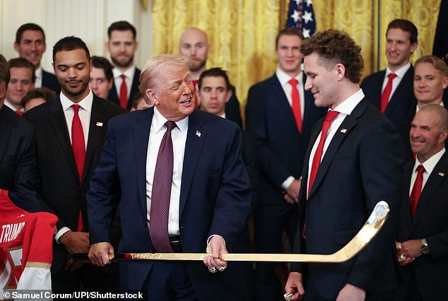 105558869-15468639-President_Donald_Trump_speaks_with_Florida_Panthers_player_Matth-a-55_17685185954.jpeg